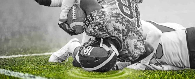 Football player hitting his head on the turf